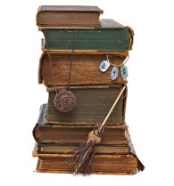 Witch books isolated with runes and medallion